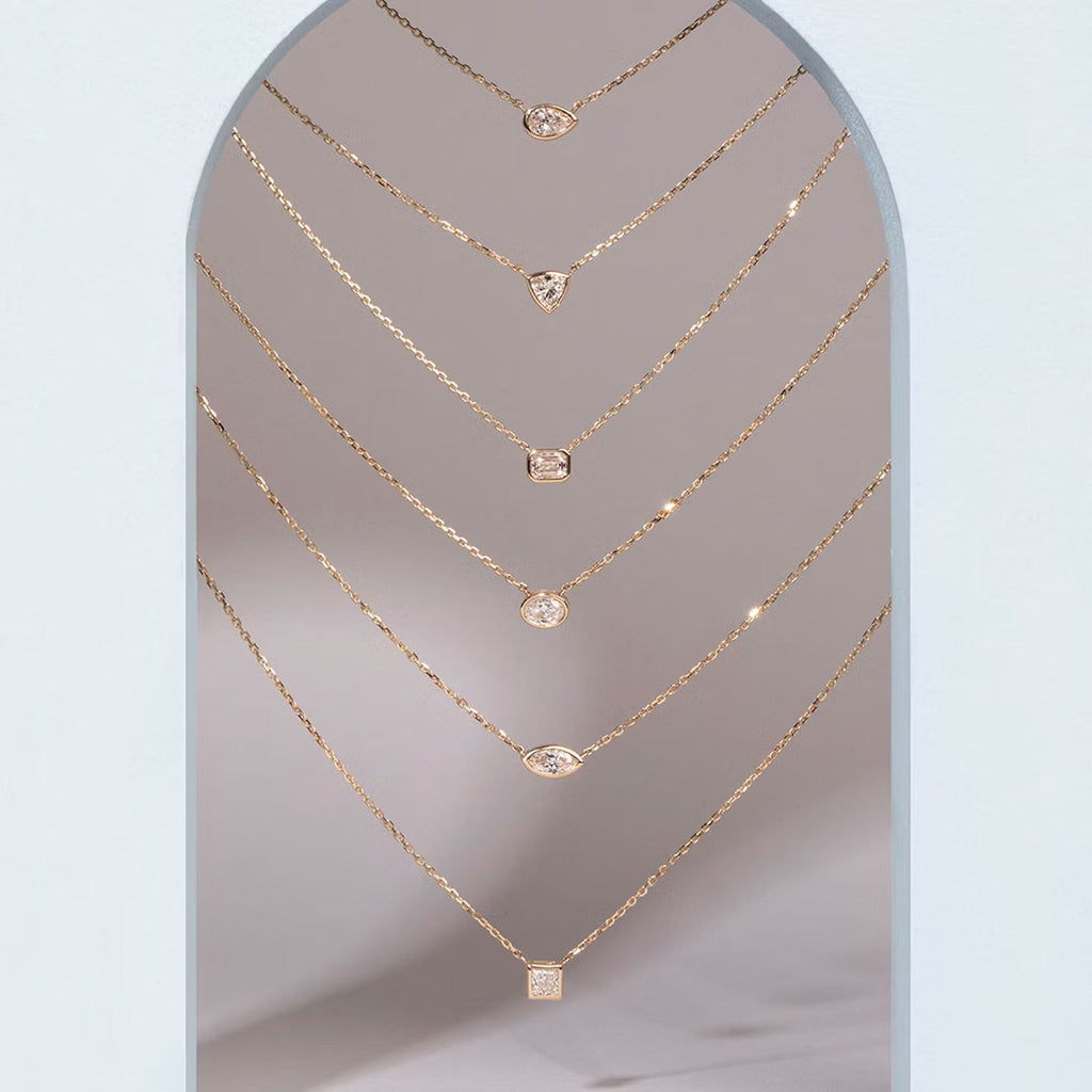 East West Solitaire Bezel- 0.25 CT Pear Moissanite Necklace