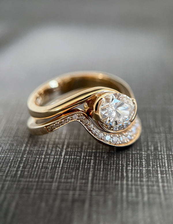 Solitaire Half Bezel Rapture & Pave Band- 1 CT Oval Lab Grown Diamond Bridal Set - Solitaire Rapture & Pave Band- Oval Lab Grown Diamond Bridal Set