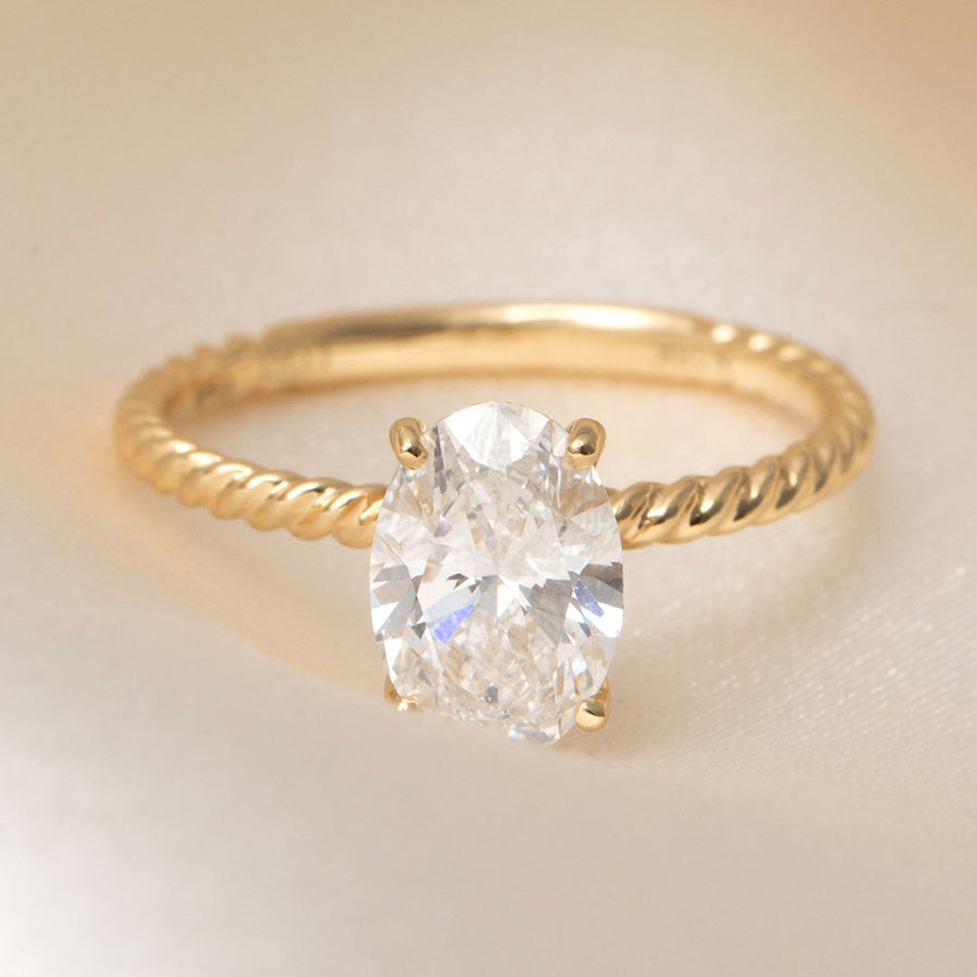 Solitaire & Twisted Shank-1.5 CT Oval Lab Grown Diamond Engagement Ring