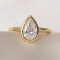 Solitare & Bezel-1.5 CT Pear Lab Grown Diamond Engagement Ring